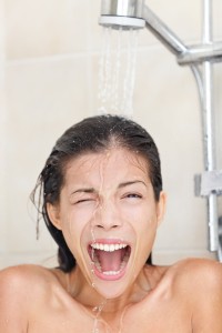 woman in shower screaming from cold
