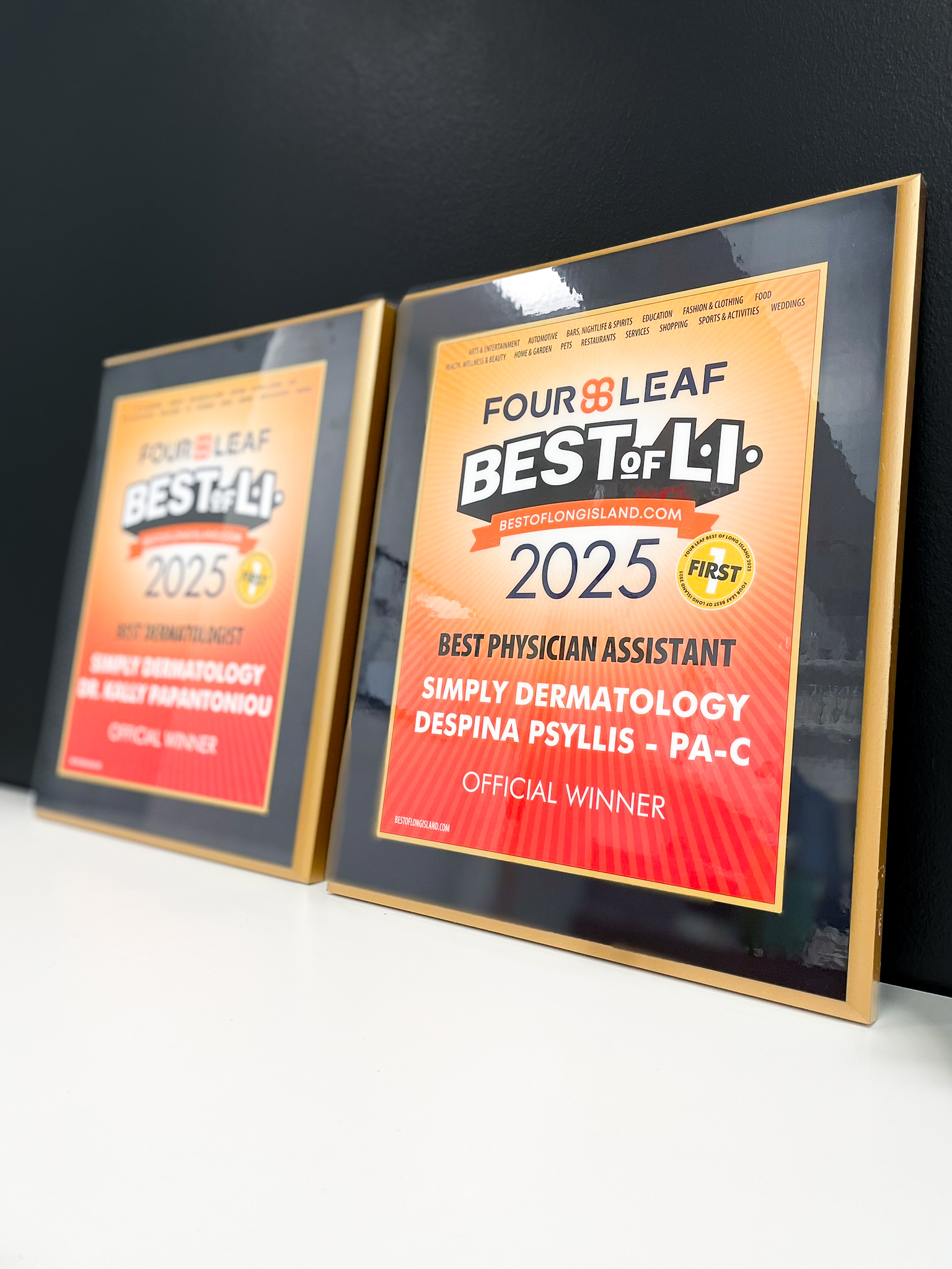 Best of Long Island 2025 plaques for Best Dermatologist (Dr. Papantoniou) and Best Physician Assistant (Despina Psyllis).
