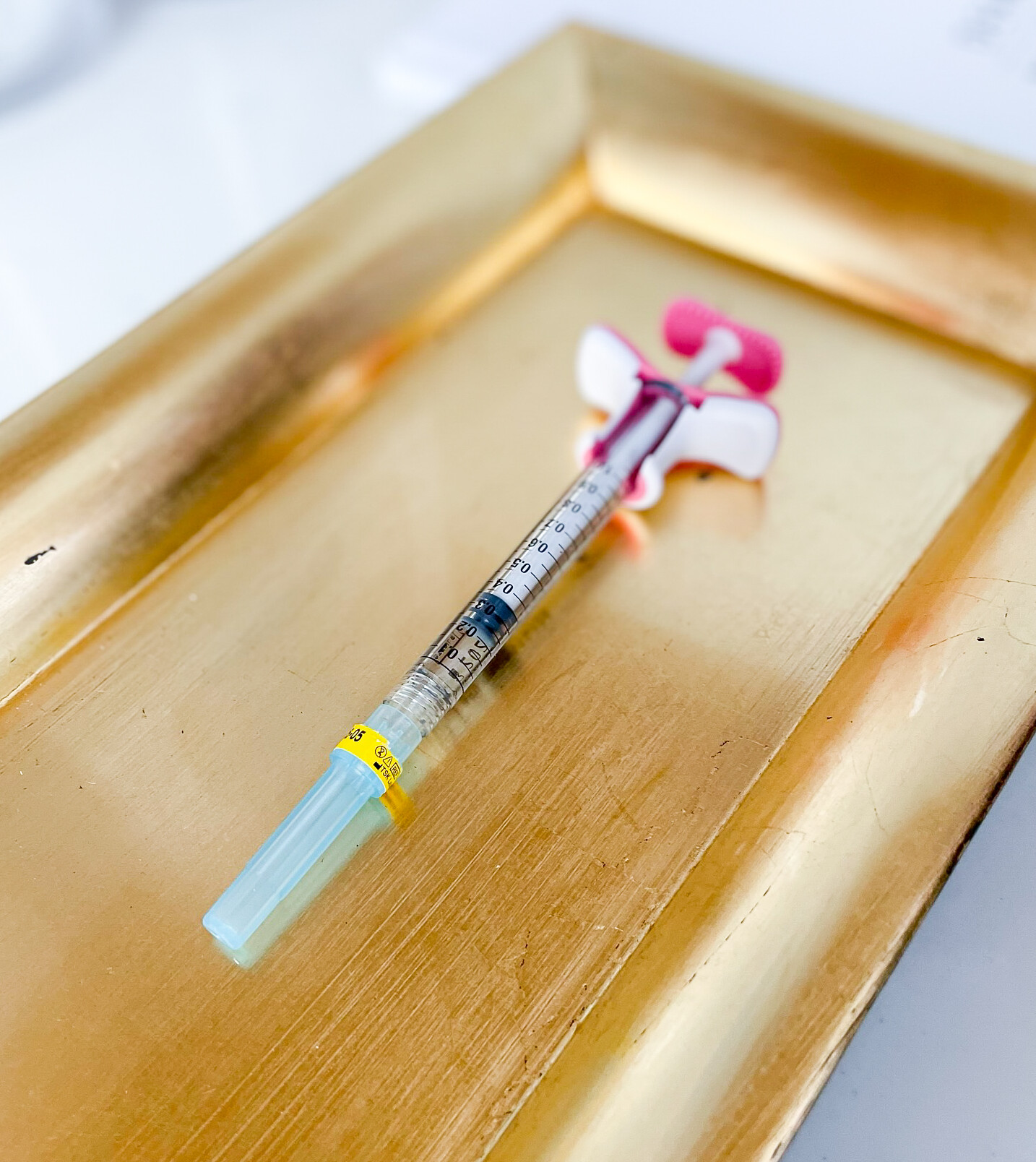 Filler on a golden tray at Simply Derm