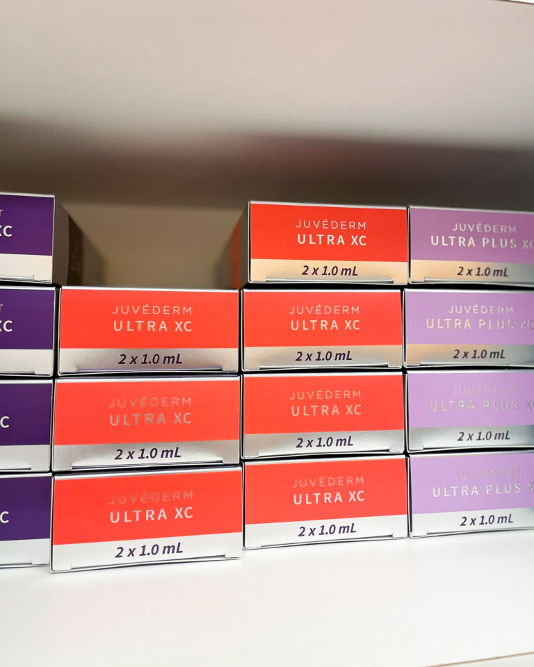 Juvederm Ultra XC and Juvederm Ultra Plus XC dermal filler boxes used for natural-looking fillers at Simply Dermatology.