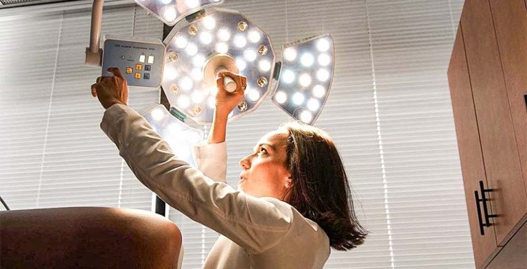 Dr. Papantoniou Adjusting an Examination Light
