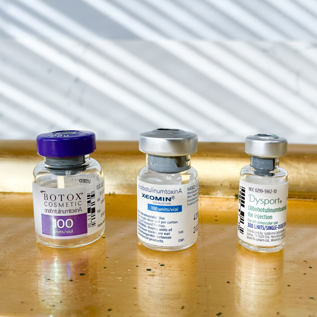 Bottles of Botox, Xeomin, and Dysport used for wrinkle treatments