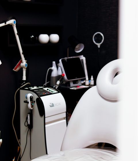 Simply Dermatology medical-grade facial treatment room Modern facial treatment room at Simply Dermatology featuring The Salt Facial device, treatment chair, and professional skincare equipment.