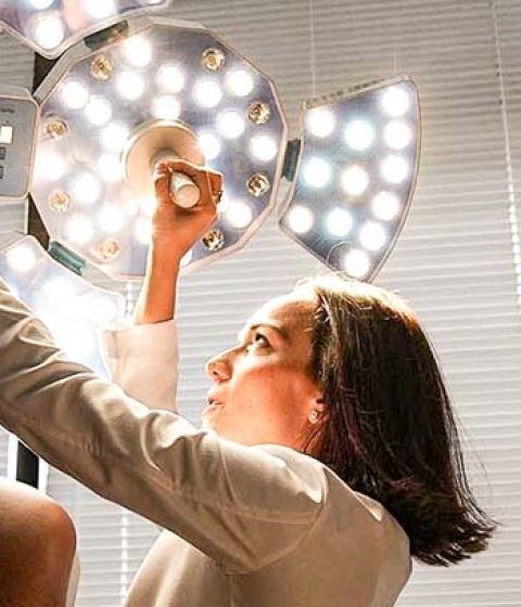 Dr. Papantoniou Adjusting an Examination Light