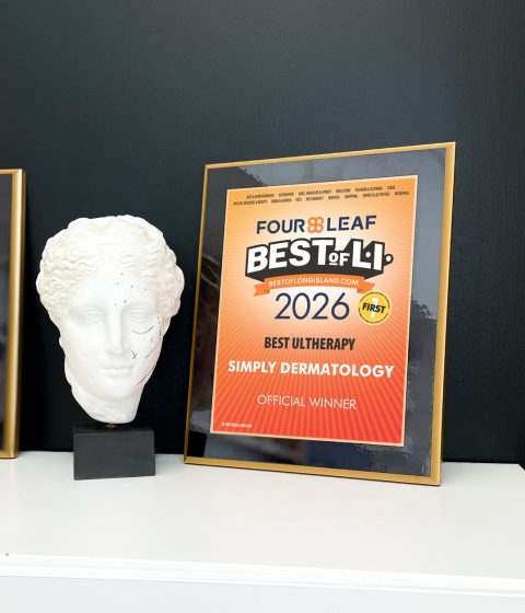 2026 Best of Long Island Best Ultherapy plaque displayed beside a white sculpture bust.