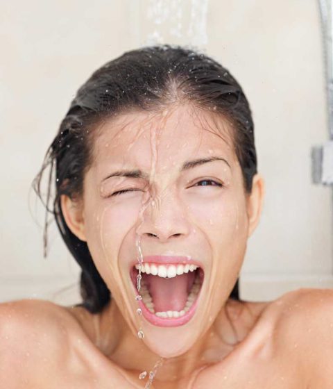 woman in shower screaming from cold