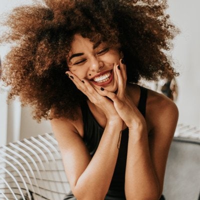 Woman with afro laughing