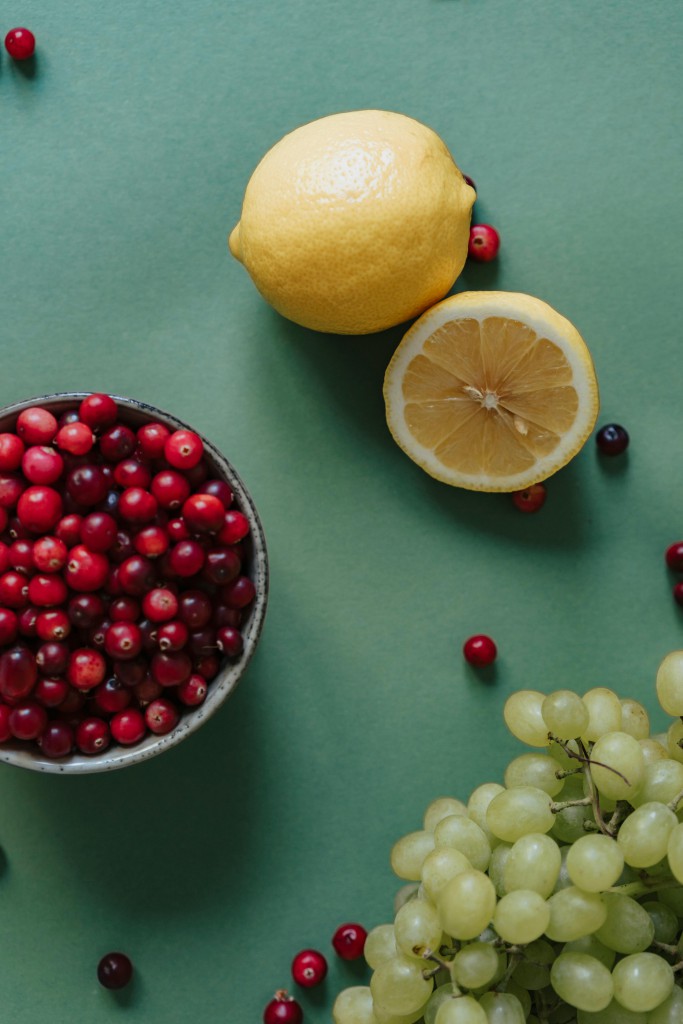 DIY Derm Cranberry Face Mask Lemons and Cranberries on table